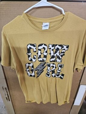 Mustard Graphic Tee with Black & White Cow Print Text